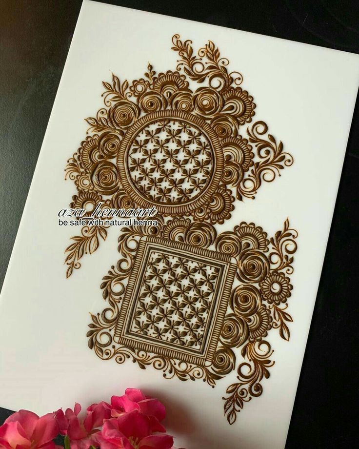 an intricately designed card with pink flowers