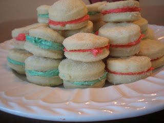 a white plate topped with cookies covered in frosting