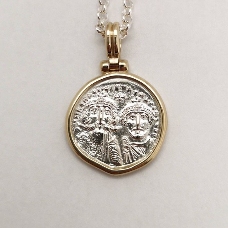 Byzantine-era coins were believed to be talismans against evil spirits, their mystical energy would give prosperity and luck to the one wearing them. It was a common practice to give such coins as gifts to newborns to protect them. This is a special statement piece, a hand-forged solid 14k yellow gold frame holds a solid sterling silver coin, exact copy of the ancient one, and hangs from a silver chain creates an ideal layering necklace. Elegant, classy, boho, classic and modern at the same time Byzantine Coin Jewelry For Ceremonial Occasions, Byzantine Style Coin Jewelry For Ceremonial Use, Antique Gold Sterling Silver Coin Necklace, Antique Sterling Silver Gold Coin Necklace, Byzantine Medallion Coin Necklace In Yellow Gold, Byzantine Yellow Gold Medallion Coin Necklace, Yellow Gold Byzantine Medallion Coin Necklace, Byzantine Style Yellow Gold Medallion Coin Necklace, White Gold Byzantine Jewelry Hallmarked