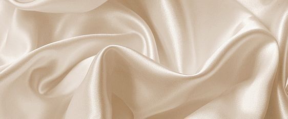 a close up view of a white satin fabric