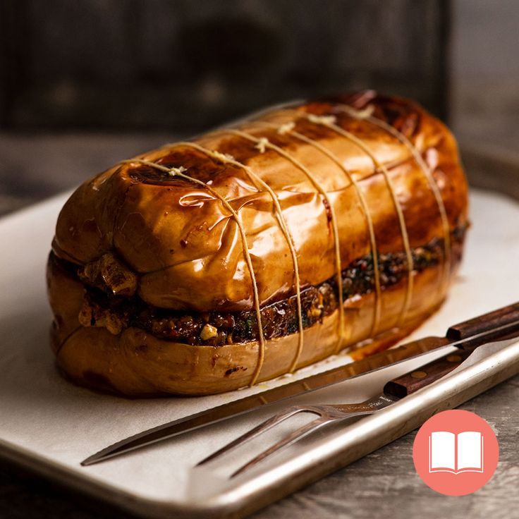 there is a sandwich on the plate with fork and knife