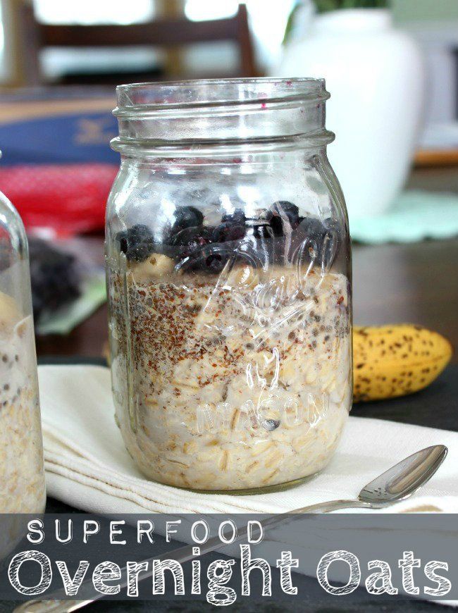 two jars filled with oatmeal sitting on top of a table next to a banana