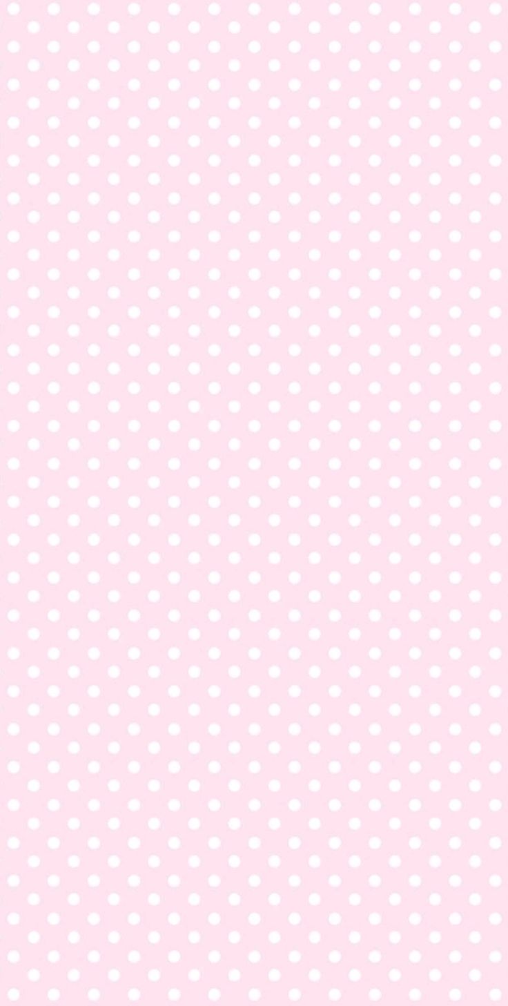 a pink background with white polka dots