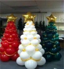 three christmas trees made out of balloons