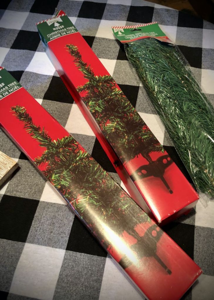 two snowboards sitting on top of a black and white checkered tablecloth