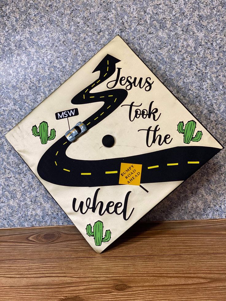 a decorated graduation cap with the words jesus took the wheel on it