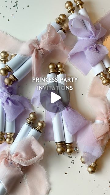 the princess party favors are made with pink, purple and gold ribboned hair clips