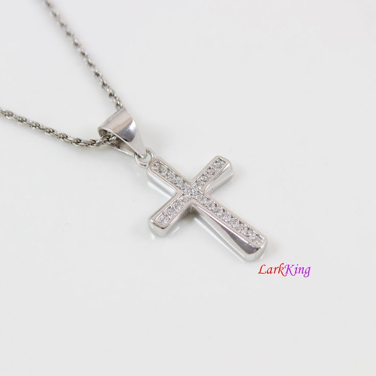 "Sterling silver cross necklace, small cross necklace, unique thick cross pendant, religious necklace, gift for Christian, gift for Baptism, christian jewelry, first communion gift. Cross pendant: Solid 925 sterling silver with cubic zirconia crystal, white gold plating Pendant size: 1/2\"x 3/4\" Pendant weight: 1.4 g Chain: white gold plating solid 925 sterling silver; high quality unique chains; see images above. To select Sterling Silver Chain Style and Length from a drop down menu: Figaro ch Sterling Silver Cross Pendant Necklace For First Communion, Sterling Silver Cross Necklace For First Communion, Silver Cross Pendant Jewelry For Baptism, Silver Cross Necklace For Baptism, Silver Crucifix Necklace For Baptism, White Gold Cross Pendant For First Communion, White Cross Pendant Necklace For Baptism, White Gold Cross Pendant Necklace For First Communion, White Cross Necklace For Baptism