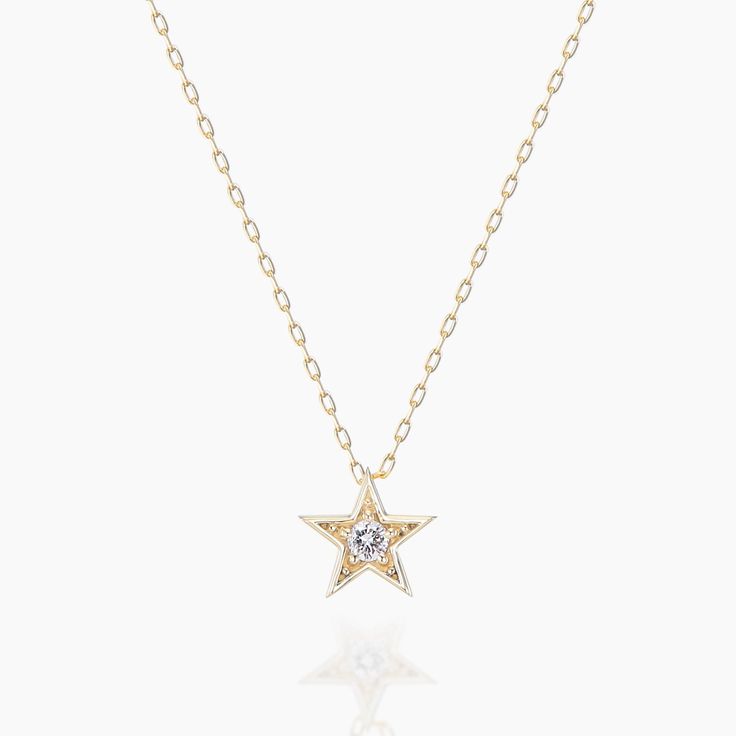 A necklace that adds the shine of the diamond to the star motif. Focus on three -dimensional effects and shapes so that it does not become too sweet and make the chest gorgeous. Diamond Star Charm Pendant Necklace, Elegant Star-shaped Chain Necklace With Star Charm, Celestial Star Clavicle Chain Necklace, Diamond Star Charm Necklace, Diamond Star Charm Necklace In Celestial Style, Celestial Diamond Star Charm Necklace, Celestial Diamond Necklace With Star Charm, Gold Star-shaped Necklace With Diamond Accents, Gold Star Necklace With Diamond Accents