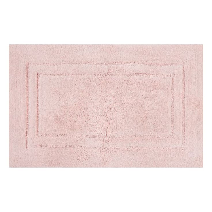 a pink bath rug on a white background