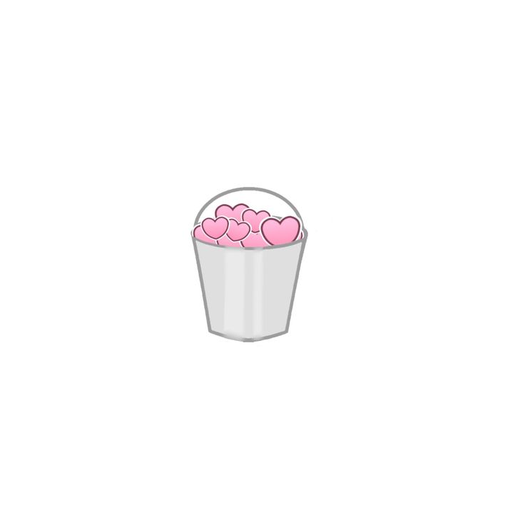 a bucket filled with pink hearts sitting on top of a table