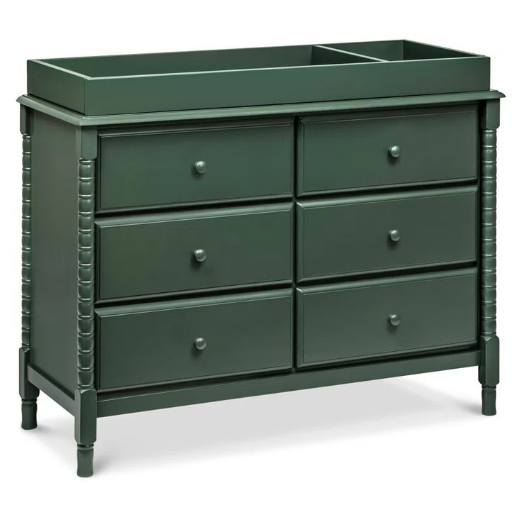 a green dresser with drawers and handles