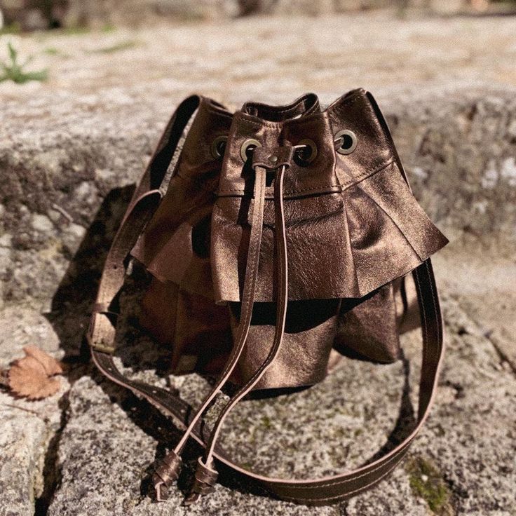 Elise Collection: Premium leather bucket bag (calf). It has a microfiber interior lining with an open pocket and an adjustable shoulder strap that will allow you to easily carry it on the shoulder, or cross-shoulder. This bag was designed and manufactured in the "Maison Rottier" artisanal workshop in the heart of the Luberon, in the south of France. Dimensions in cm (HxLxD): 25x22x11 Gold Pouch Bucket Bag For Daily Use, Gold Bucket Shoulder Bag With Detachable Strap, Gold Bucket Bag With Dust Bag For Daily Use, Gold Bucket Bag With Adjustable Strap, Gold Bucket Shoulder Bag With Removable Pouch, Leather Bucket Shoulder Bag With Dust Bag, Gold Bucket Bag For Travel, Gold Bucket Shoulder Bag For Travel, Gold Bucket Bag With Adjustable Strap For Evening