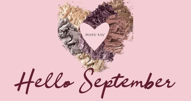 the words hello september written in front of a heart made out of different colored powders