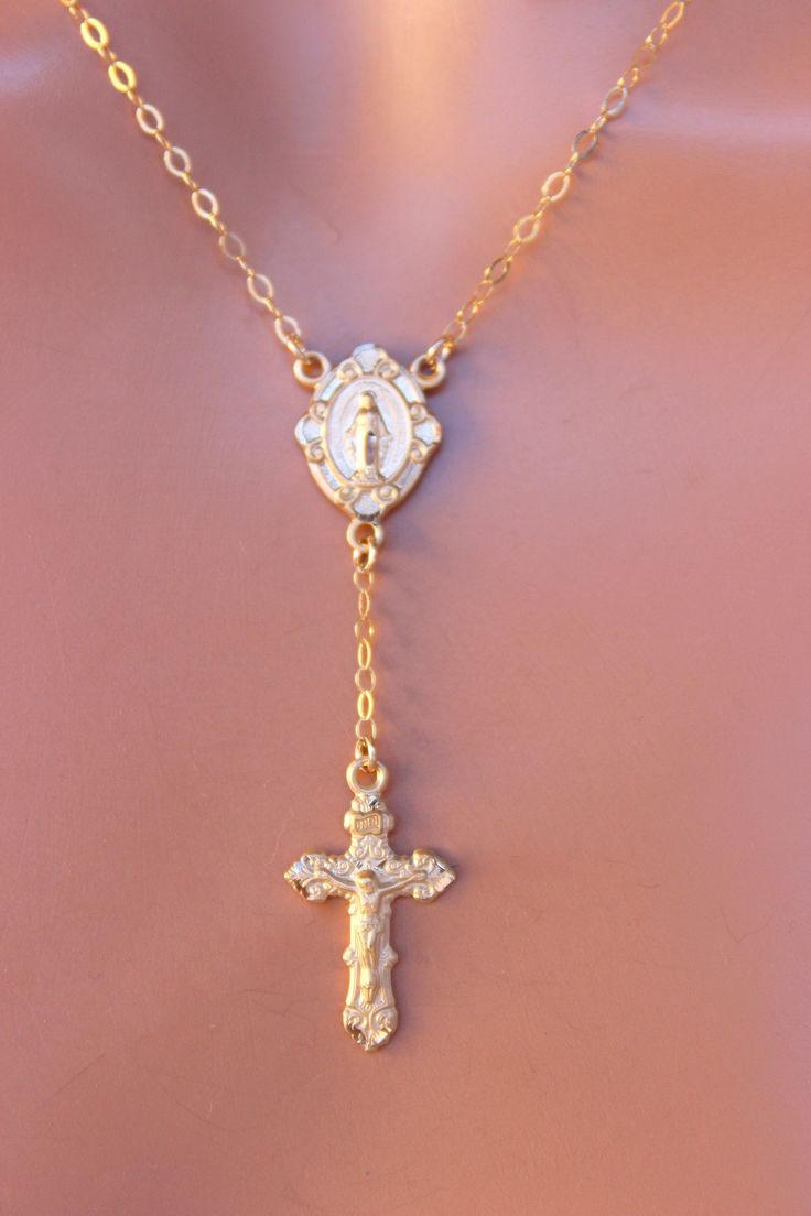 "This is a beautiful unique rosary inspired necklace for women! This gorgeous necklace features 15x12mm Miraculous center medallion and a 22x13mm gold crucifix cross pendant. Both medals are are made of 14k gold over 925 sterling silver). Chain is 14k gold filled with spring clasp in back. Choose necklace length of 16\",18\" 20\" or 22\" length (this is the measurement around the neck only, does not include the drop) . Drop with cross measures 2.5\". This necklace comes nicely boxed, the perfect Rosary Inspired Necklace, Mary Jewelry, Gold Rosary Necklace, 14kt Gold Jewelry, Gold Rosary, Clean Sterling Silver, Catholic Jewelry, Inspired Necklace, Rosary Necklace