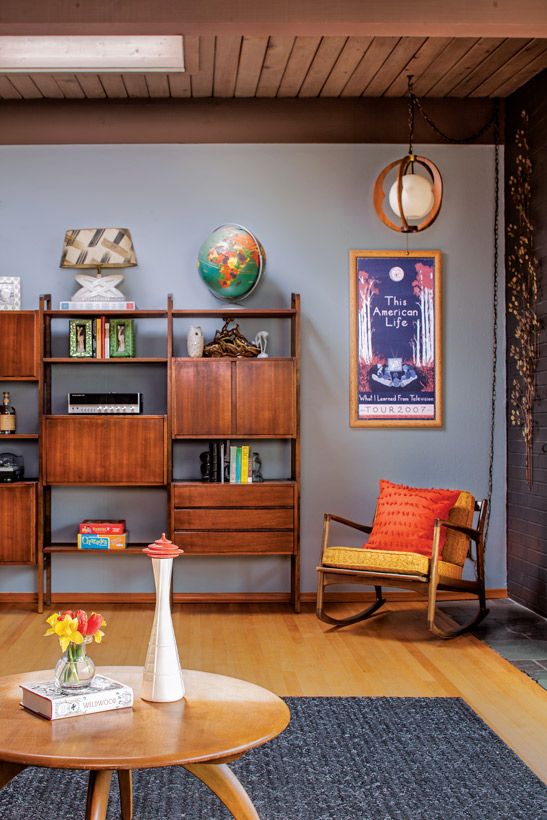 a living room filled with furniture and bookshelves