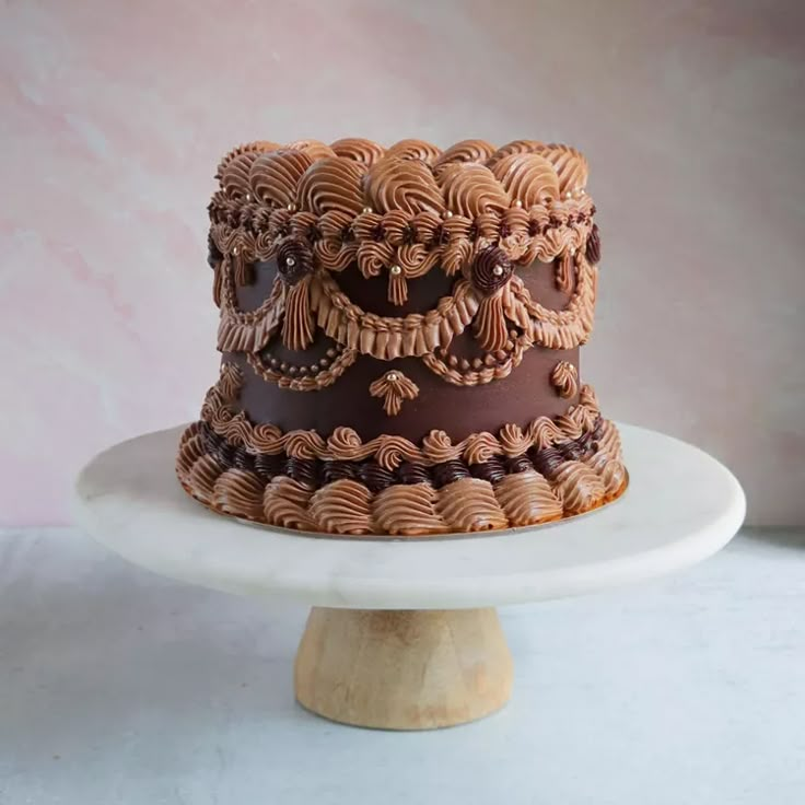 there is a cake that has been decorated with chocolate icing on the top and sides