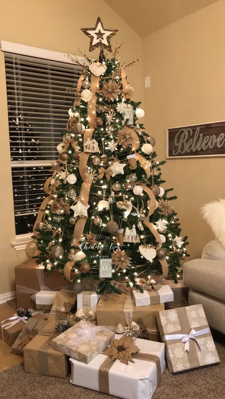 a decorated christmas tree with presents under it