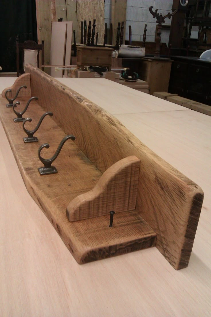 a bench made out of wood with metal handles