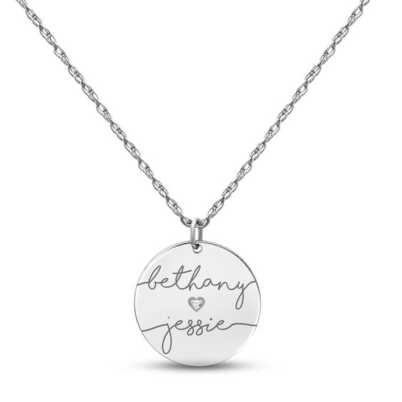 A sweet and romantic way to show your love, this couple's necklace features a 14K white gold disc customized with both of your names in an elegant script font. A single round diamond shines in a dainty heart design for a hint of sparkle. The pendant suspends from an 18-inch rope chain thats secures with a spring ring clasp. Engraved White Gold Name Necklace For Anniversary, Engraved Round Pendant Name Necklace For Valentine's Day, Personalized White Gold Name Necklace For Valentine's Day, Valentine's Day Engraved White Gold Name Necklace, Elegant Name Necklace With Engraving For Anniversary, Elegant Anniversary Name Necklace With Engraving Option, Customizable White Gold Necklace For Anniversary, Round Name Necklace For Wedding, Customizable White Gold Name Necklace For Anniversary