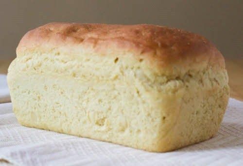 a loaf of bread sitting on top of a white cloth