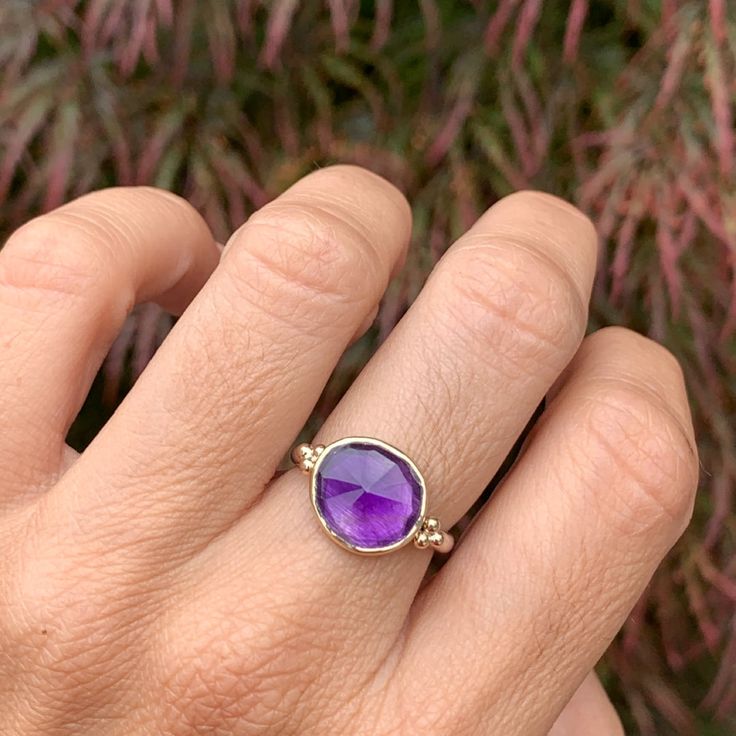 One of the most vibrant Amethysts we have come across, this rosecut gem is set in 14k yellow gold with gold accent beads, and a sterling silver freeform band. Approx stone size: 12mm x 10mm Approx ct weight: 3.2cts Mohs hardness: 8 This one of a kind piece is handmade with love in Emily's Hudson Valley studio. If you have questions about sizing, shipping or need help deciding on your perfect piece please reach out to us! Stacked Engagement Ring, Birthstone Stacking Rings, Diamonds Ring, Local Jewelry, Diamond Shop, Gold Accent, Diamond Cluster Ring, Diamond Cluster, Hudson Valley