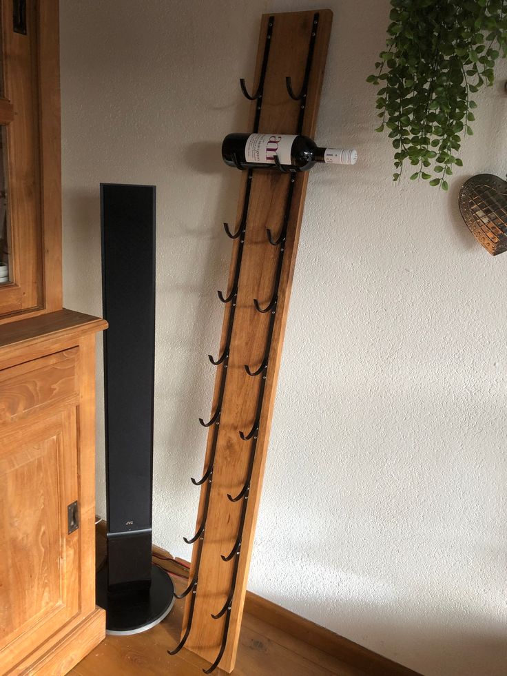 a wine rack is next to a wooden cabinet