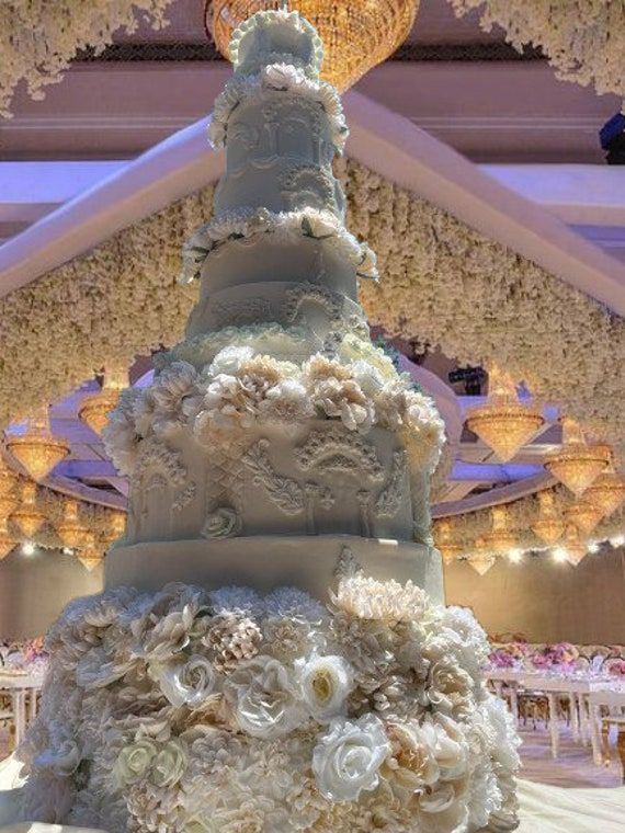 a large wedding cake sitting on top of a table