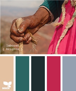 a person holding a stick in their hand and color swatches on the other side