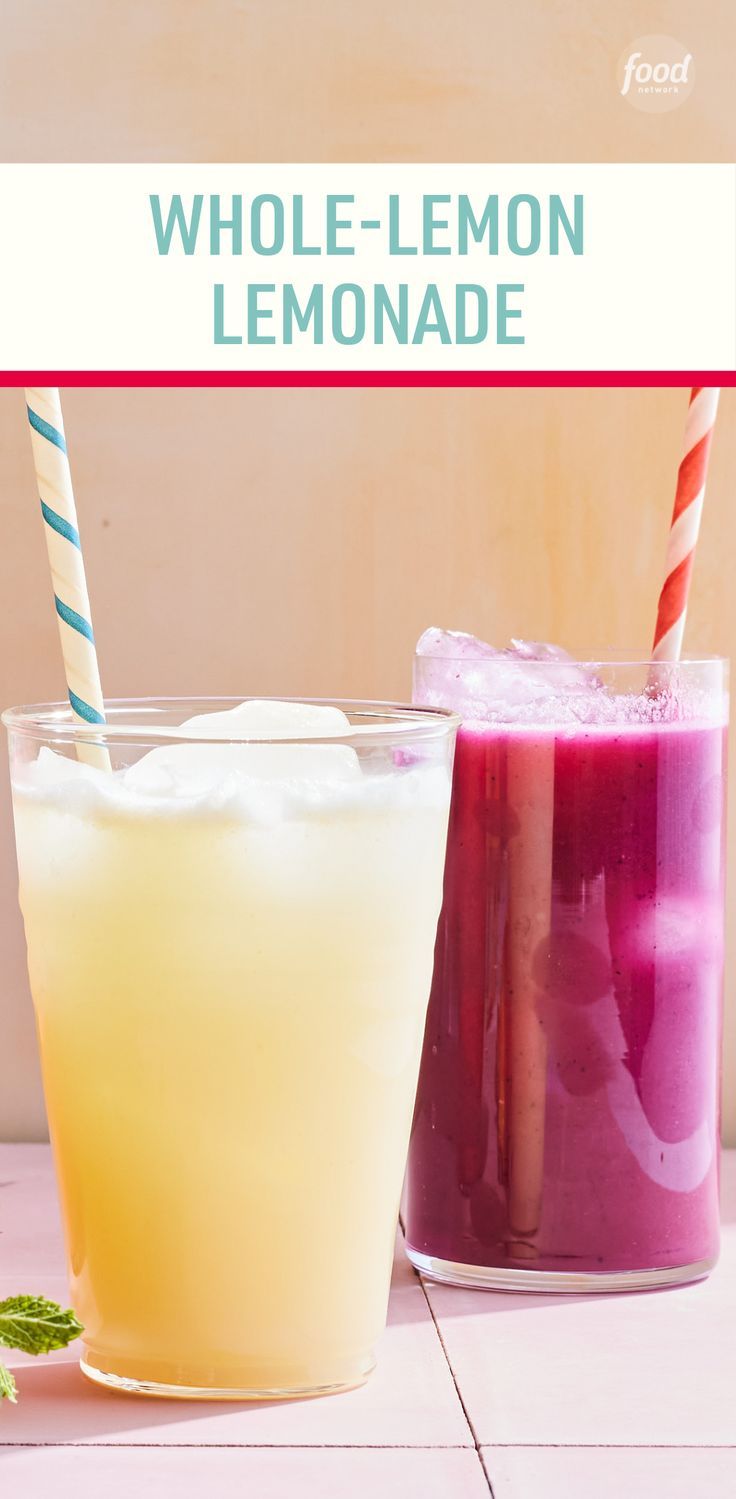 two glasses filled with different colored drinks next to each other