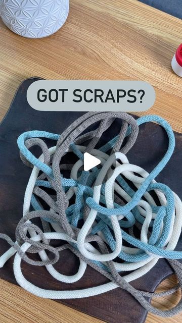 a pile of cords sitting on top of a wooden table