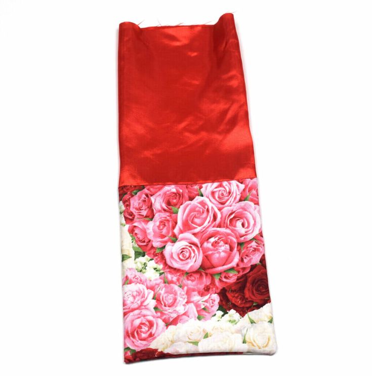 a red and white bag with roses on it