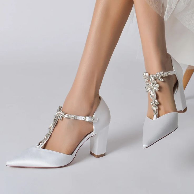 Women Shoes, Ladies Shoes, Women's Shoes, Pumps Sexy High Heels Shoes Buckle Ladies Shoes Female Shoes Women Heels Sandals Women Sandals Stiletto Looking for the perfect wedding, engagement, prom, party shoe? Then take a look at our beautiful, crystal beaded, high heeled pumps. There is nothing like a pair of great heels to elevate any occasion or lend instant style to any outfit. These gorgeous strappy formal shoes are no exception! Featuring decorative beaded T-Strap design, thin ankle strap, buckle strap closure, classic pointed toe, soft inner cushioning for comfort, non slip, ridged rubber soles, and finely finished with stylish high block 3.15" / 8.0cm heels, these dreamy formal shoes are an easy choice for any formal occasion. Made from high quality vegan and eco-friendly Satin and Wedding Shoes Pumps, Formal Pumps, Wedding Pumps, T Strap Heels, Wedding Shoes Heels, 2022 Trends, Womens Wedding Shoes, Prom Shoes, Pointed Toe Heels