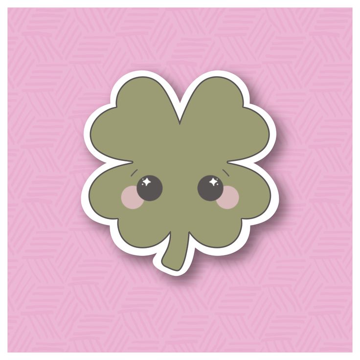 a sticker with an image of a four leaf clover on it's face