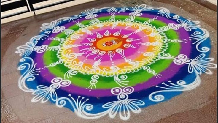 a colorful rangdi design on the ground