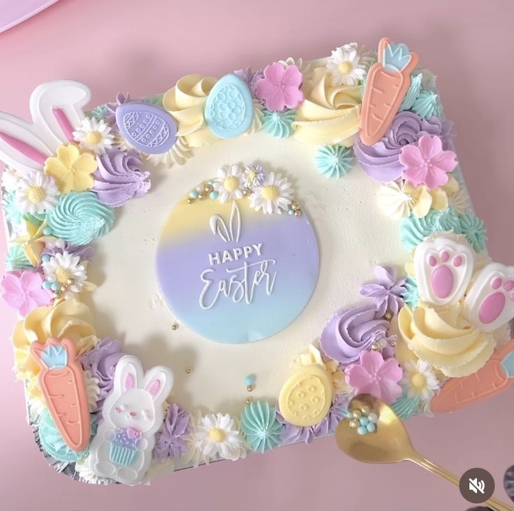 a cake decorated with easter decorations and bunny ears