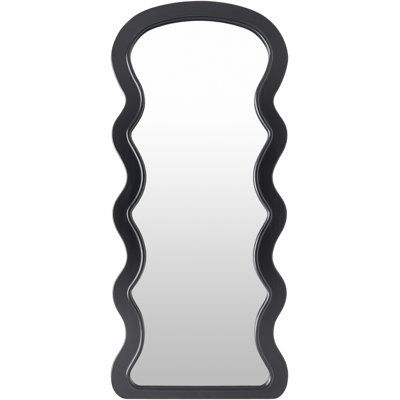 a mirror that is black and has wavy lines on the bottom of it, as well as an oval shaped frame