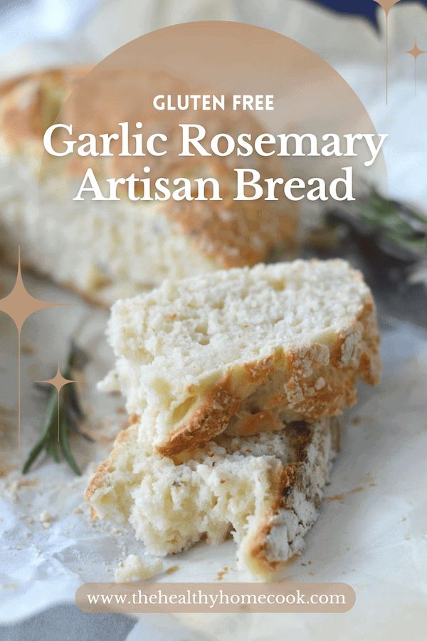 the gluten free garlic rosemary artisan bread is cut in half and sitting on top of parchment paper