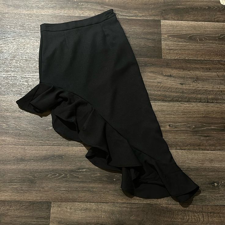 Black Dress Skirt. Longer In The Left Side. Zipper On Side. Brand New. Black Asymmetrical Skirt With Layered Hem, Black Asymmetrical Skirt With Side Zipper, Edgy Black Asymmetrical Skirt, Black Asymmetrical Rock Skirt, Black Draped Asymmetrical Skirt, 2023 Mood, Practice Wear, Asymmetrical Skirt, Dance Costume