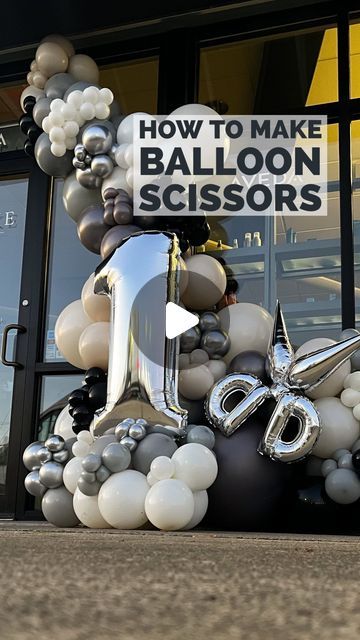 balloons are arranged in the shape of letters and numbers on display outside a balloon store