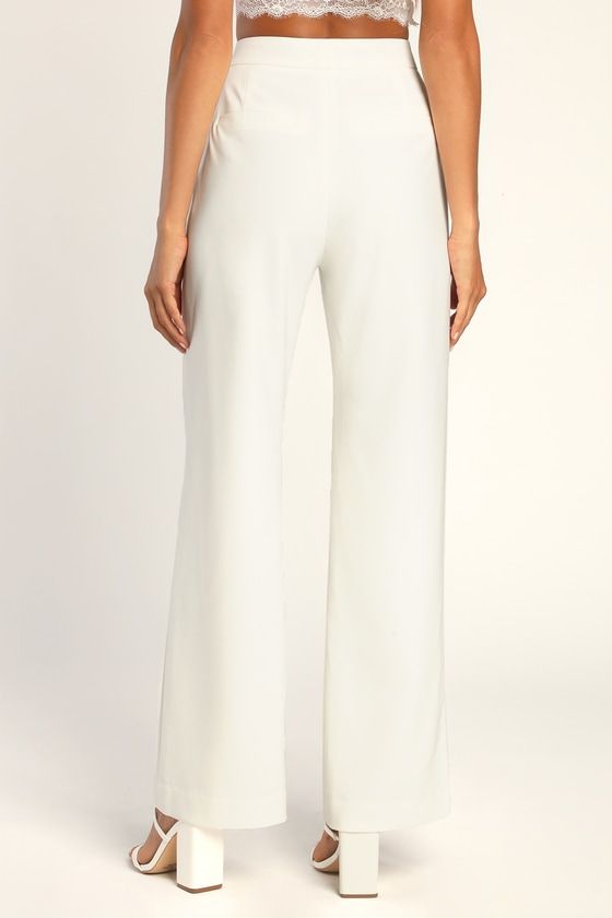 Have all the confidence you need with the Lulus A Power Mood White High-Waisted Wide-Leg Trouser Pants! Lightweight crepe woven fabric shapes a boss-babe, high banded waist with a hidden zip fly and a covered button closure. Wide pant legs fall to ankle-grazing hems and feature decorative welt pockets at the back. Pair with the matching blazer for a complete look! Fit: This garment fits true to size. Length: Floor length. Size medium Inseam: 31.25 Front Rise: 11.50 Waist: Fitted - very fitted at Lulu Fashion, Pants Large, Wide Pants, Trouser Pants, Boss Babe, Welt Pockets, Wide Leg Pants, Floor Length, Woven Fabric