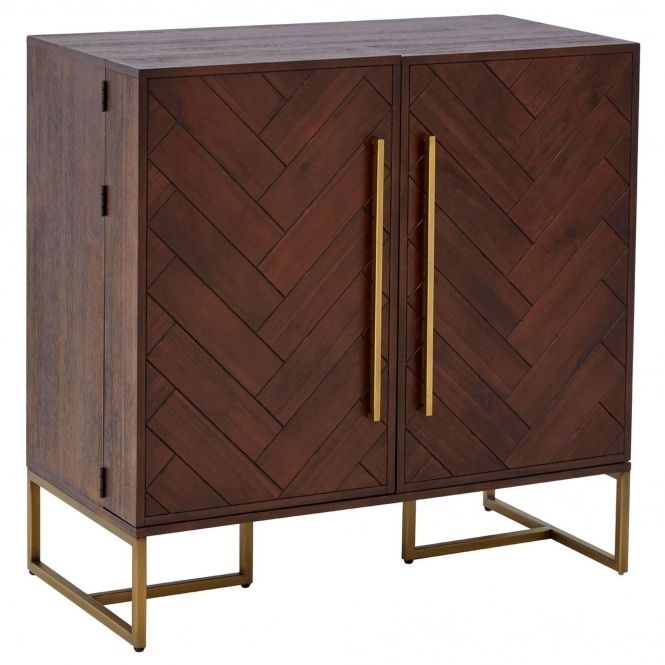 a wooden cabinet with two doors and gold handles