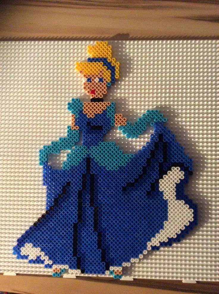 an image of a woman in a blue dress made out of perler bead