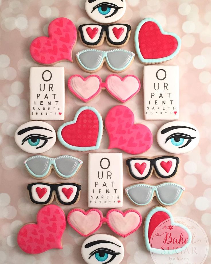 decorated cookies with eyeglasses, hearts and words on the top are for valentine's day