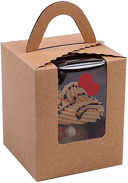 a cardboard box with a cupcake in it and a red heart on the top