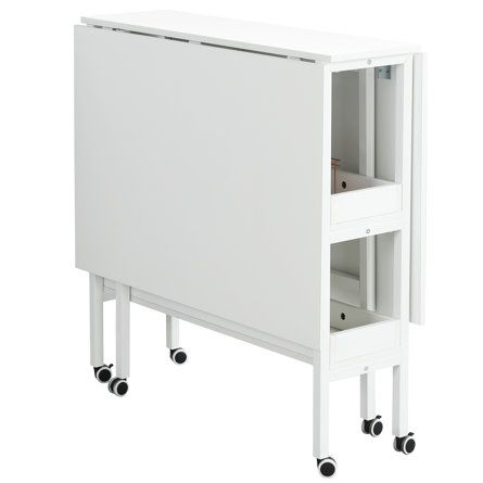 a white cabinet sitting on wheels with drawers