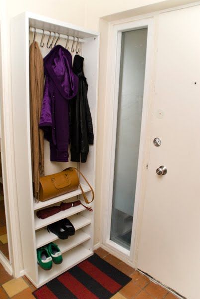 an open closet with shoes and handbags on the floor