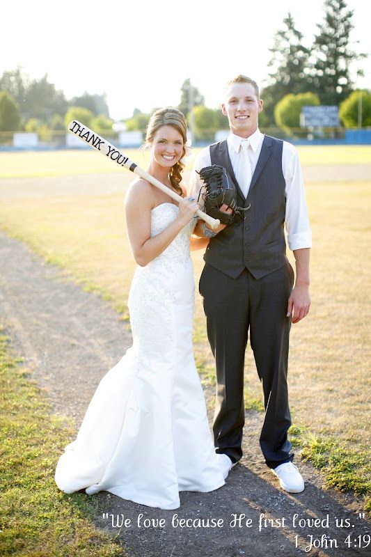 a bride and groom holding baseball bats in their hands