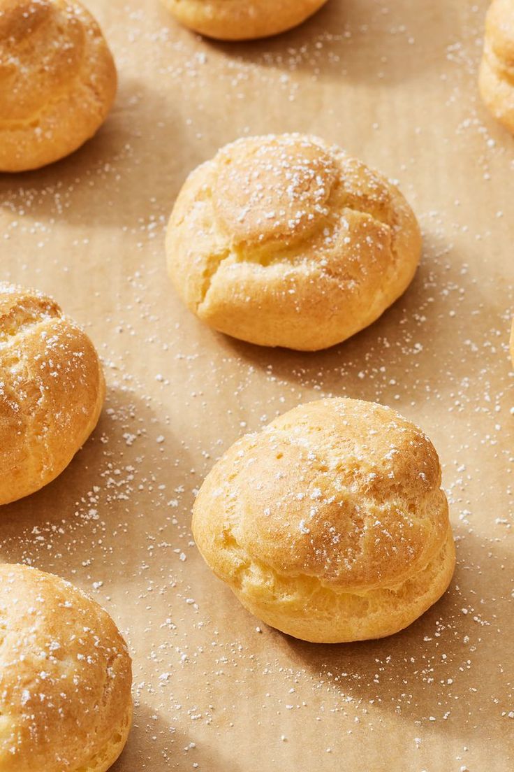 freshly baked cookies on a baking sheet covered in powdered sugar