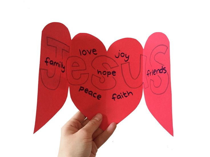 someone is holding up two hearts with the words jesus, love, joy and peace written on them